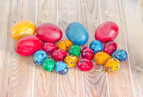 Colored traditional Easter eggs, quails egg, close up, wood background. Stock Photos