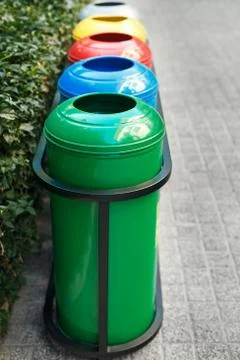 Colored trash containers for garbage separation Stock Photos