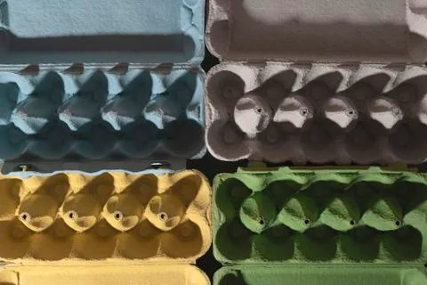Colored trays from eggs. Garbage collection for recycling concept. Stock Photos
