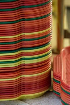Colored trays in a stack on the table Stock Photos