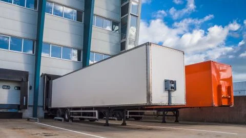 Colored truck trailers loading Stock Photos