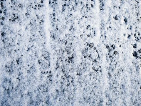 Colored vector grunge texture of a small layer of snow on the asphalt Ilustração Stock