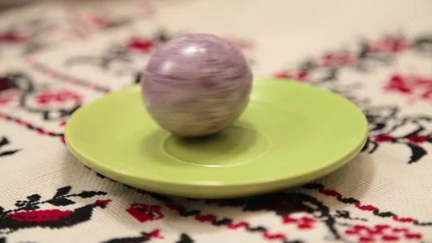 Colored violet egg for Easter is spinning Stock Footage 131147117