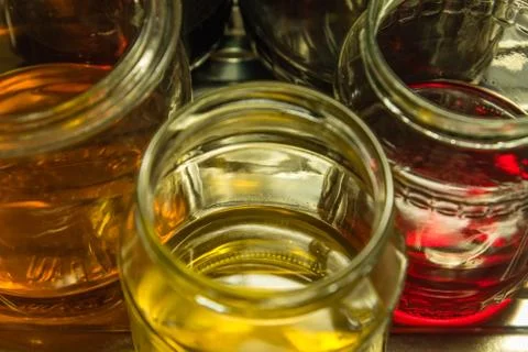 Colored water at three classes from the top Stock Photos