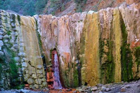 Colored waterfall caldera la palma Spain Stock Photos