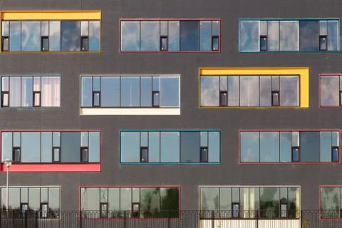 Colored windows of the building with the sky reflected in the glass. Geometric Stock Photos