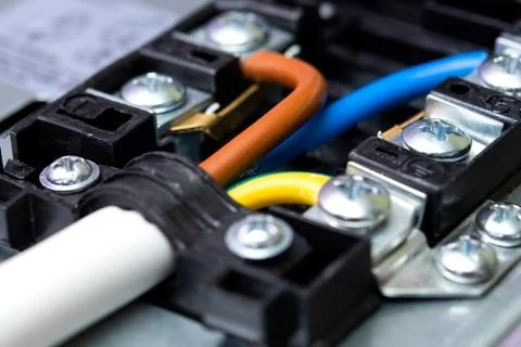 Colored wires are connected to the electrical terminal Foto stock