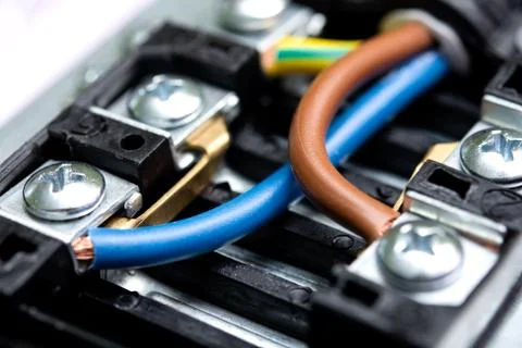 Colored wires are connected to the electrical terminal Foto stock