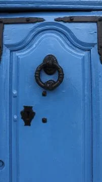 Colored wooden doors with metal knobs Fotos de archivo