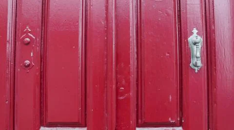Colored wooden doors with metal knobs Foto stock