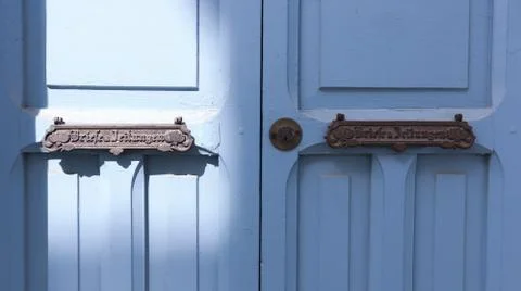 Colored wooden doors with metal knobs Fotos de archivo
