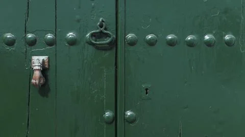 Colored wooden doors with metal knobs Foto stock