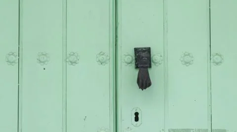 Colored wooden doors with metal knobs Fotos de archivo
