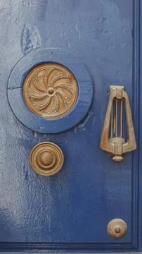 Colored wooden doors with metal knobs 写真素材