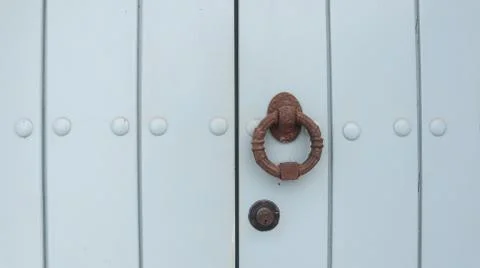 Colored wooden doors with metal knobs 写真素材