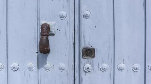 Colored wooden doors with metal knobs Foto stock
