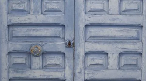 Colored wooden doors with metal knobs Stock Photos
