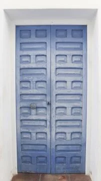 Colored wooden doors with metal knobs 写真素材