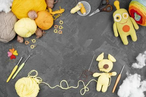 Colored wool with dolls copy space. High quality photo Stock Photos
