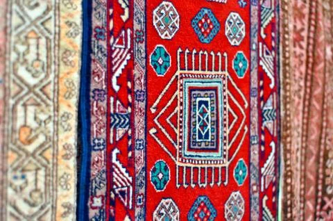 Colored wool handmade carpets closeup Stock Photos