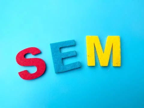 Colored word with text SEM on a blue background. Stock Photos