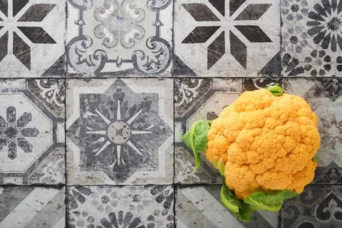 Colorfu cauliflower. Various sort of cauliflower on stone tiles gray concrete Stock Photos
