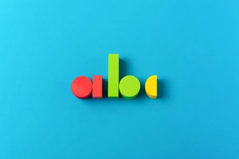Colorful ABC letters blocks learning education concept blue background Stock Photos