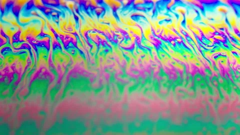 Colorful abstract background fluid rainbow colors in motion, macro shot Stockbeeldmateriaal 130244809