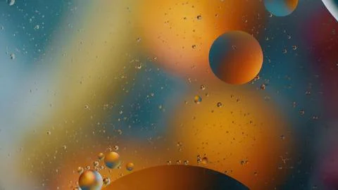 Colorful abstract composition of floating bubbles and shapes against a vibrant Foto stock