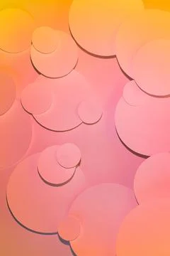 Colorful abstract pattern with circles in gradient light of pink and yellow c Stock Photos