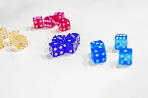 Colorful acrylic dice on a light background Stock Photos