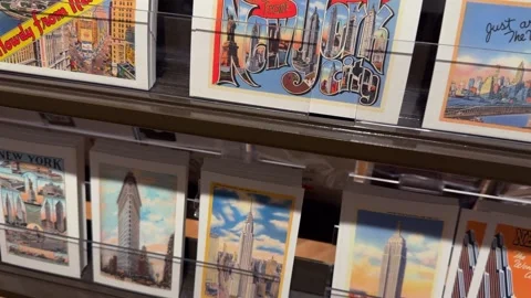 A Colorful and EyeCatching Postcard Display at a Charming Gift Shop for Visitors Vídeos de archivo 295077728