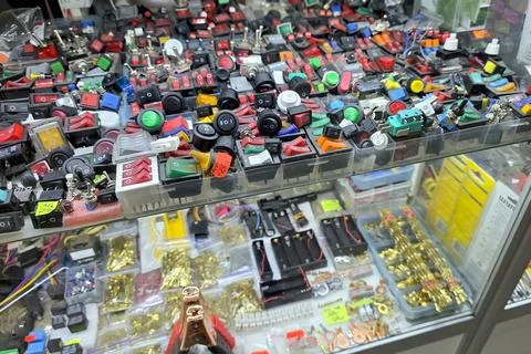 Colorful Array of Electrical Switches Displayed on a Counter at a Market Stock Photos