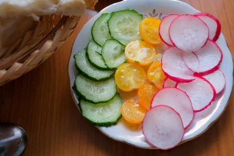 Colorful array of fresh vegetables arranged on a decorative plate Stock Photos