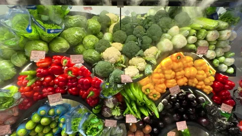 Colorful array of fresh vegetables beautifully arranged in market. Stock Footage 306282965