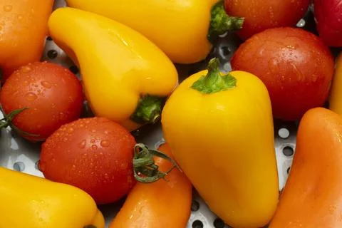 Colorful array of fresh vegetables in a kitchen setting Stock Photos