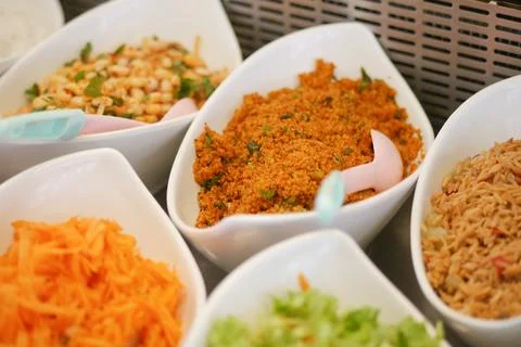 Colorful array of salads and side dishes at a buffet table Stock Photos