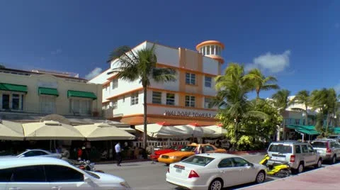 Colorful Art Deco architecture and sidewalk cafes in Miami Beach Stock Footage