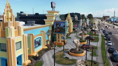 Colorful Art Deco tower marks Ron Jon Surf Shop plaza in Cocoa Beach Florida Stock Footage 340298757
