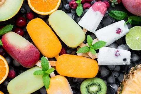 Colorful assortment of berry flavored ice cream bars displayed on a flat surface Stock Photos