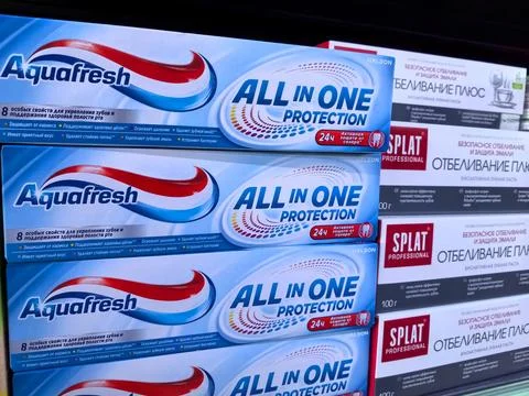 Colorful assortment of toothpaste boxes displayed in a store aisle Stock Photos