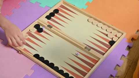 Colorful backgammon game setup on foam mat with dice and chips Stock Footage 290052695