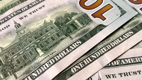 Colorful background backdrop of US hundred dollar banknotes scattered Stock Footage 283732995