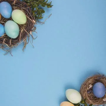 Colorful background with Easter eggs on blue background. Happy Easter concept Stock Photos