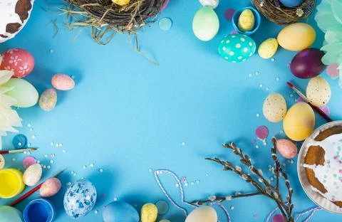 Colorful background with Easter eggs on blue background. Happy Easter concept Stock Photos
