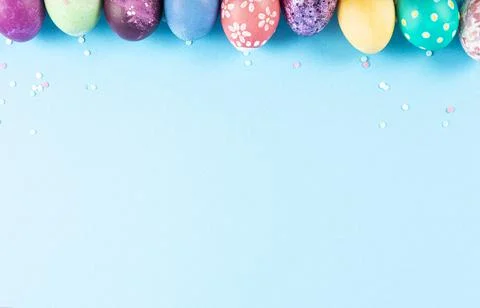 Colorful background with Easter eggs on blue background. Happy Easter concept Stock Photos