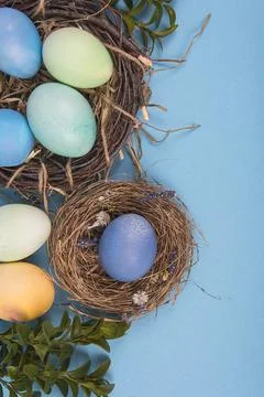 Colorful background with Easter eggs on blue background. Happy Easter concept Stock Photos