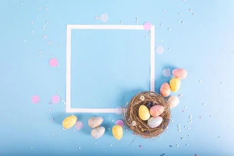 Colorful background with Easter eggs on blue background. Happy Easter conce.. Stock Photos