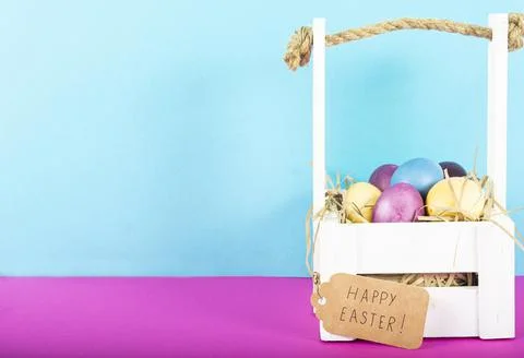 Colorful background with Easter eggs on pink and blue background. Happy Easte Stock Photos