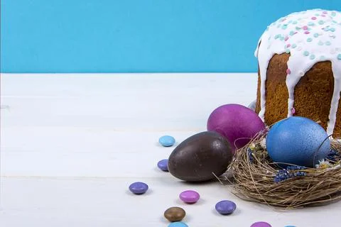 Colorful background with Easter eggs on white wooden board background. Happy  Stock Photos